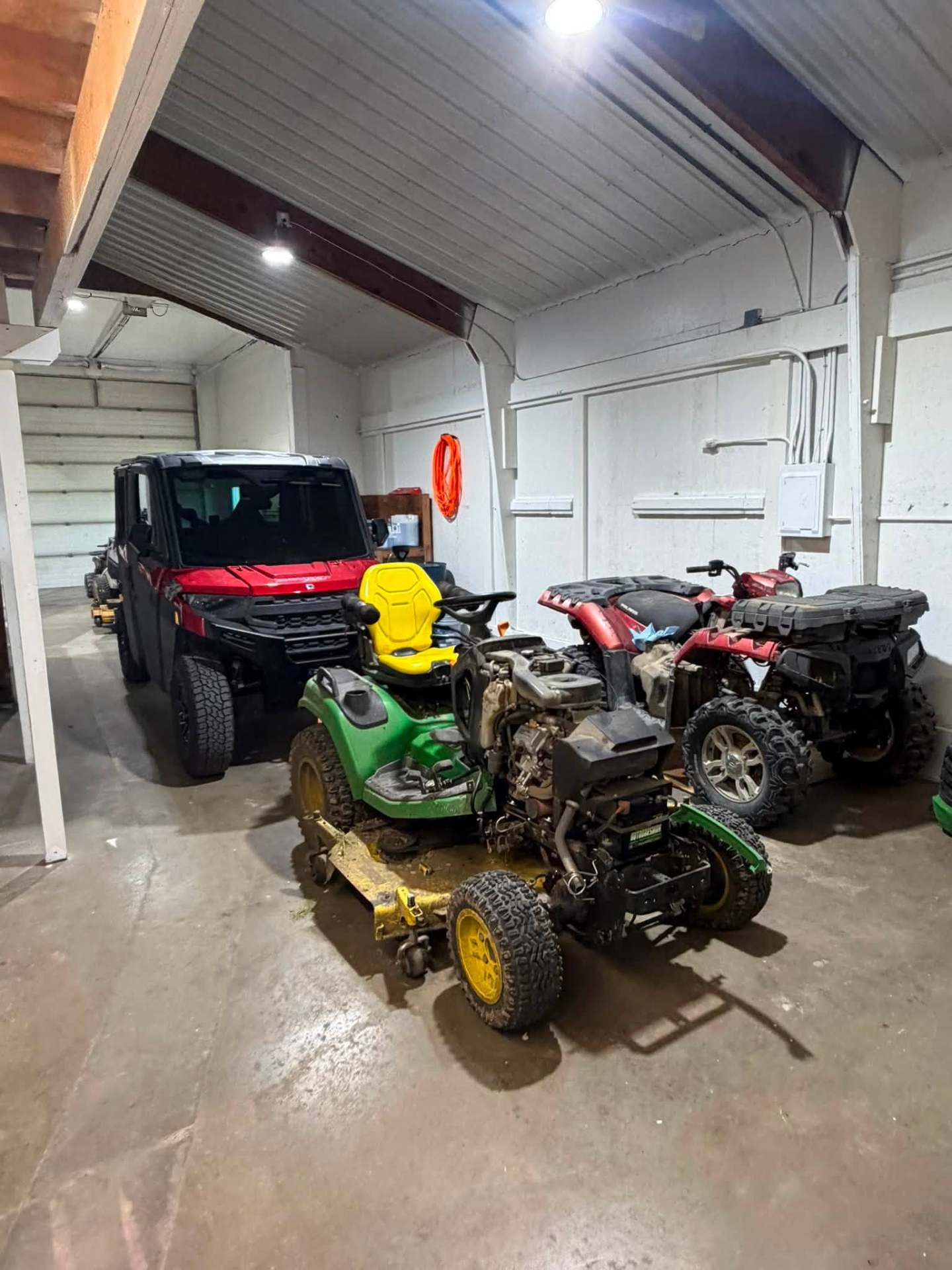 Recent shop work showing ATVs and power sports vehicles in our garage