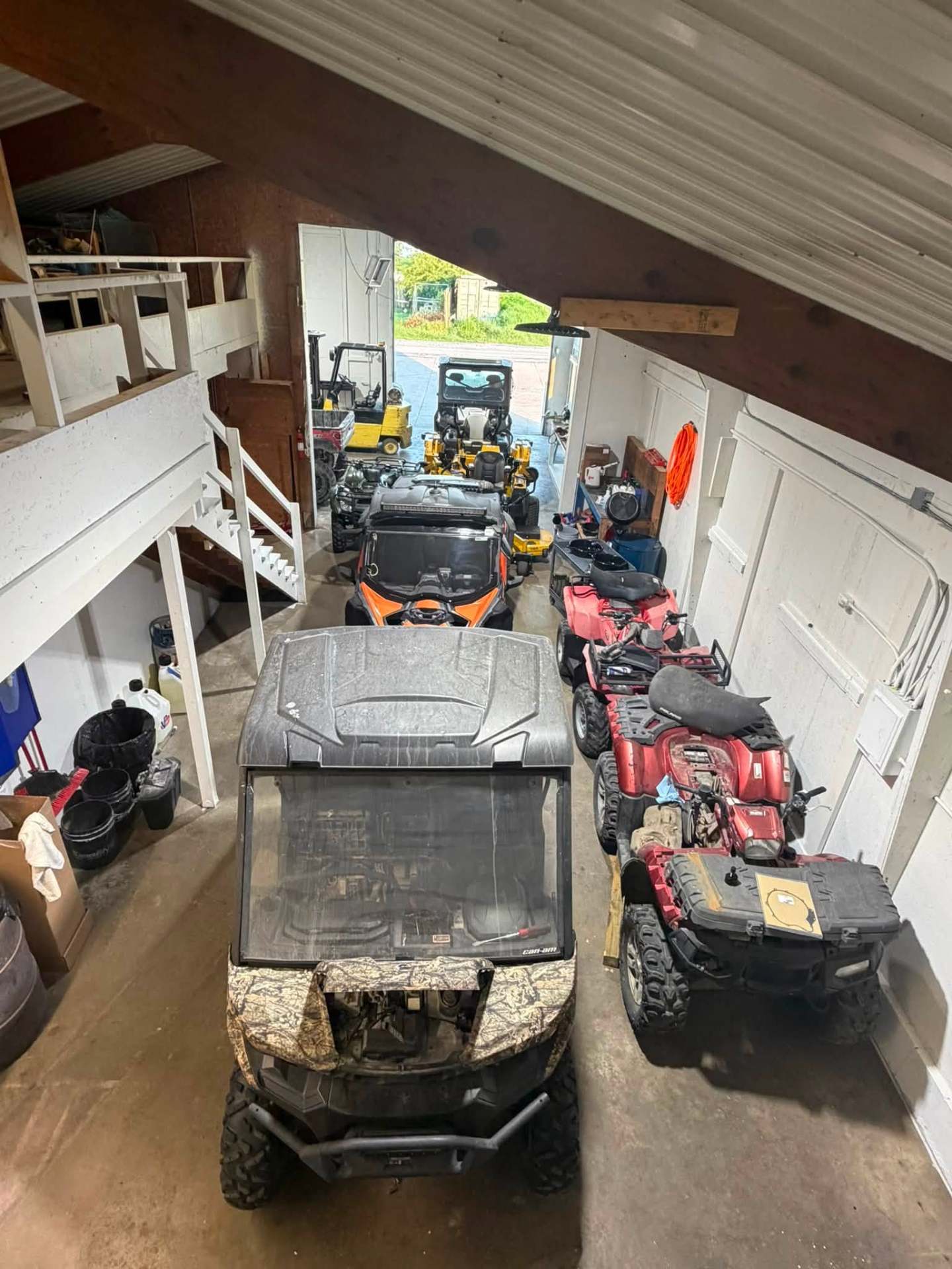 Recent shop work showing ATVs and power sports vehicles in our garage