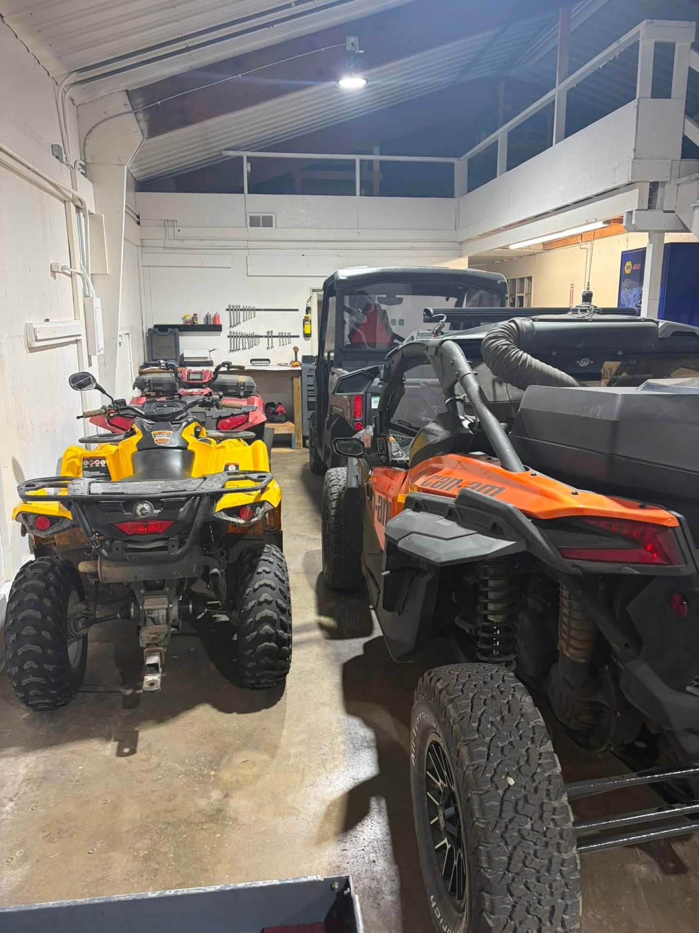 Recent shop work showing ATVs and power sports vehicles in our garage